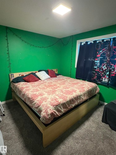 Wall-to-wall carpeting and a ceiling-mounted light fixture - 49480 Rge Rd 41, Rural Leduc County, AB - Indoor Photo Showing Bedroom