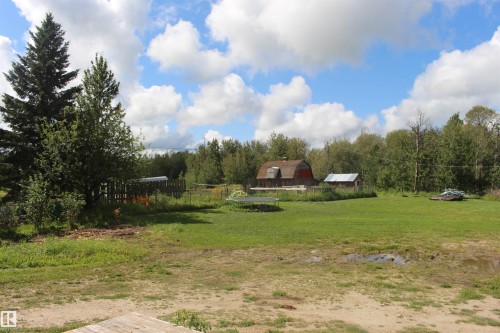 Expansive grassy area with mature trees and a fenced perimeter - 49480 Rge Rd 41, Rural Leduc County, AB - Outdoor With View