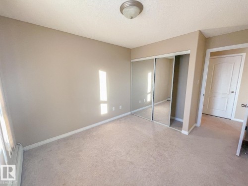 #409 5350 199 St Nw, Edmonton, AB - Indoor Photo Showing Other Room