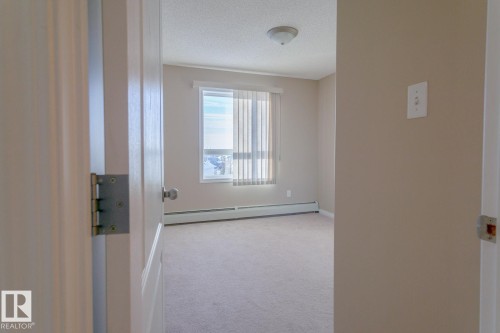 #409 5350 199 St Nw, Edmonton, AB - Indoor Photo Showing Other Room