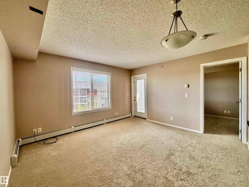 Open-concept floor plan - #409 12035 22 Av Sw, Edmonton, AB - Indoor Photo Showing Other Room
