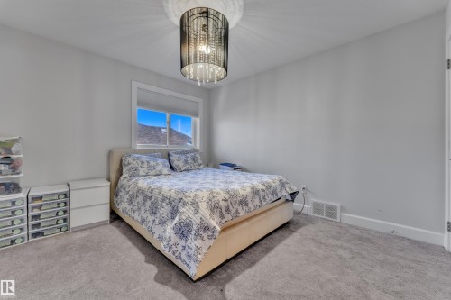 Carpeted flooring, recessed window, and contemporary ceiling light fixture - 10915 175 Avenue Nw, Edmonton, AB - Indoor Photo Showing Bedroom