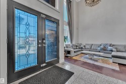 Double entry doors with decorative glass panels - 