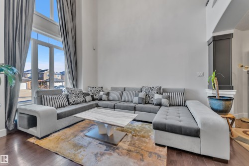 Soaring ceilings with expansive windows - 10915 175 Avenue Nw, Edmonton, AB - Indoor Photo Showing Living Room