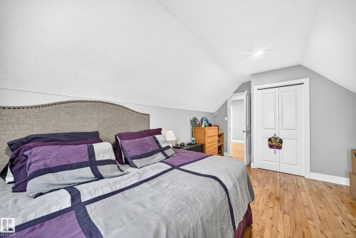 Sloped ceilings, hardwood flooring, and white bi-fold closet doors - #38 24512 Sturgeon Rd, Rural Sturgeon County, AB 