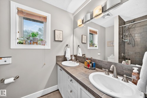 Dual basin vanity with tile countertop and integrated backsplash - #38 24512 Sturgeon Rd, Rural Sturgeon County, AB 