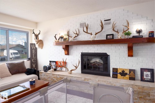 5019 42 Street, Cold Lake, AB - Indoor Photo Showing Living Room With Fireplace