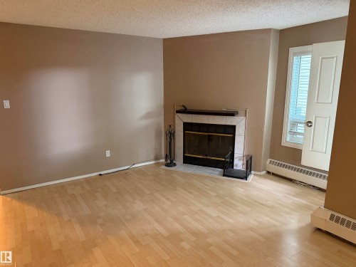 #203 11807 101 St Nw, Edmonton, AB - Indoor Photo Showing Living Room With Fireplace