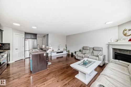 6419 18 Avenue Sw, Edmonton, AB - Indoor Photo Showing Living Room With Fireplace