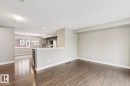 Wood-finish flooring, recessed lighting, and a half-wall partition - 5409 3 Avenue Sw, Edmonton, AB  - Indoor Photo Showing Other Room 