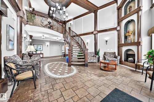 #209 102 Bridgeport Cx, Leduc, AB - Indoor Photo Showing Other Room With Fireplace
