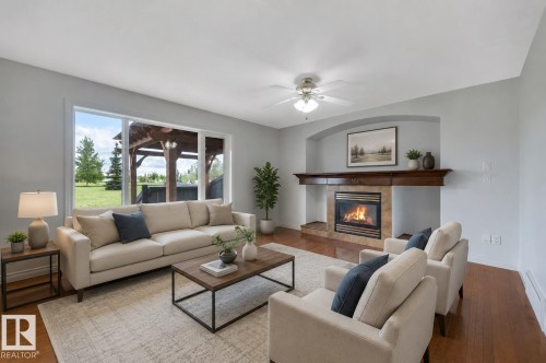 24 Birchmont Drive, Leduc, AB - Indoor Photo Showing Living Room With Fireplace