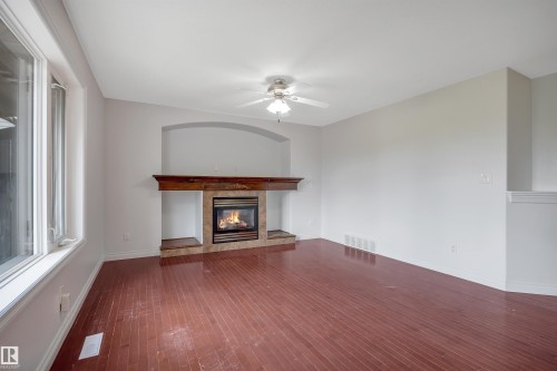 24 Birchmont Drive, Leduc, AB - Indoor Photo Showing Living Room With Fireplace