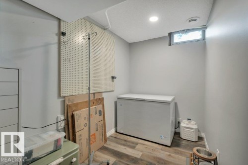 Light grey painted walls and vinyl plank flooring - #138 5231 51 St, Bon Accord, AB - Indoor