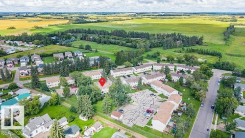 Aerial perspective showcasing residential properties and expansive green spaces - #138 5231 51 St, Bon Accord, AB - Outdoor With View
