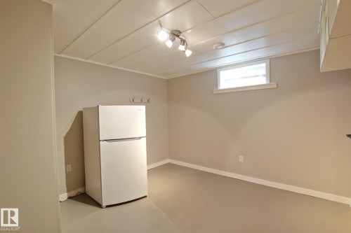 Recessed panel ceiling, track lighting, neutral wall paint, window, light-toned flooring - 5712 113B Street Nw, Edmonton, AB - Indoor
