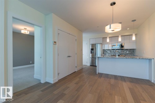 #401 11969 Jasper Av Nw, Edmonton, AB - Indoor Photo Showing Kitchen With Upgraded Kitchen
