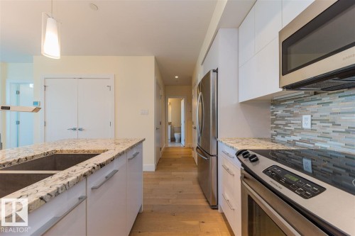 #401 11969 Jasper Av Nw, Edmonton, AB - Indoor Photo Showing Kitchen With Double Sink With Upgraded Kitchen