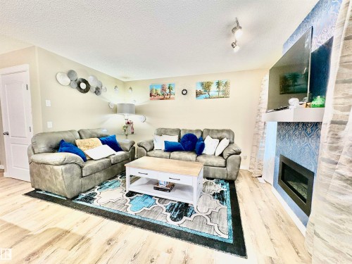 1824 Rutherford Road Sw, Edmonton, AB - Indoor Photo Showing Living Room With Fireplace