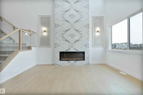 573 Ashgrove Circle, Leduc, AB - Indoor Photo Showing Living Room With Fireplace