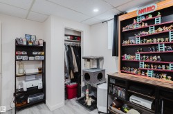 Recessed lighting illuminates this versatile space featuring wood-finish flooring - 