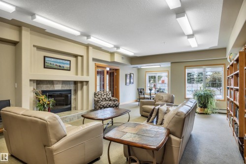 #104 612 111 St Sw, Edmonton, AB - Indoor Photo Showing Living Room With Fireplace