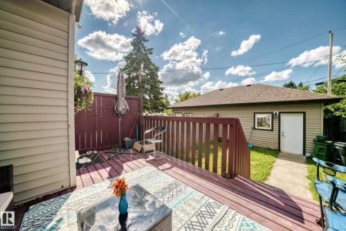 Wood-finish deck with a privacy fence - 12730 118 Street Nw, Edmonton, AB - Outdoor With Deck Patio Veranda With Exterior