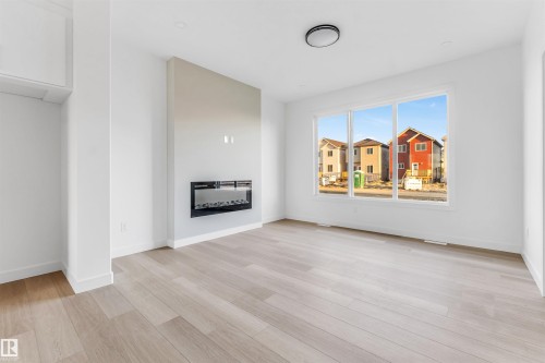 554 Ashgrove Circle, Leduc, AB - Indoor Photo Showing Living Room With Fireplace