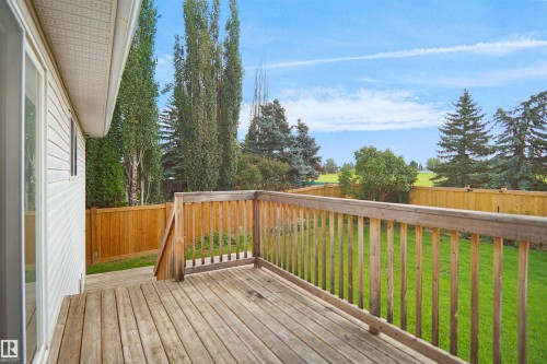 Wood deck featuring a wood railing and a sliding glass door - 907 Jordan Crescent Nw, Edmonton, AB - Outdoor With Deck Patio Veranda