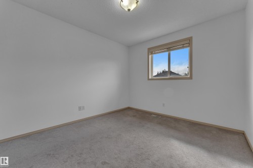 First upstairs bedroom, can fit a queen or double bed with space! - 14031 136 Street Nw, Edmonton, AB - Indoor Photo Showing Other Room