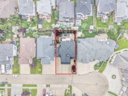 Aerial view showcasing the property's footprint, including a private paved driveway, and a rear patio area - 27 Kingdom Place, Leduc, AB - Other