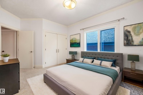 Recessed lighting, soft carpeting, built-in closet with double doors, and a large window - 27 Kingdom Place, Leduc, AB - Indoor Photo Showing Bedroom