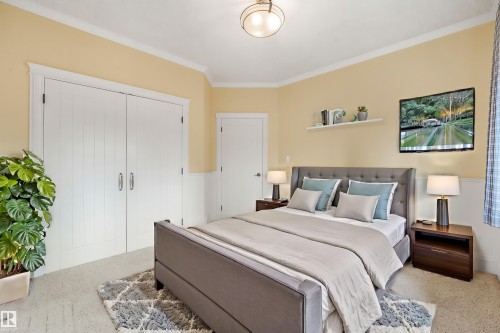 Wall-to-wall carpeting and wainscoting with a decorative floating shelf - 27 Kingdom Place, Leduc, AB - Indoor Photo Showing Bedroom