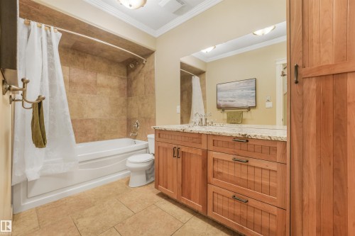 Built-in vanity with granite countertop and undermount sink - 27 Kingdom Place, Leduc, AB - Indoor Photo Showing Bathroom