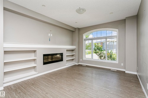 8103 Chappelle Way Sw, Edmonton, AB - Indoor Photo Showing Other Room With Fireplace