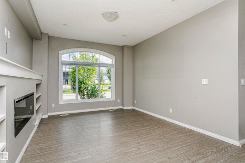 8103 Chappelle Way Sw, Edmonton, AB - Indoor Photo Showing Other Room With Fireplace