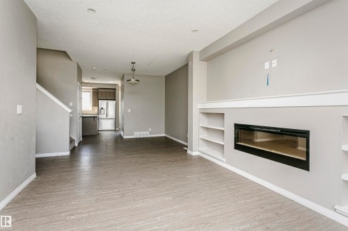 8103 Chappelle Way Sw, Edmonton, AB - Indoor Photo Showing Living Room With Fireplace