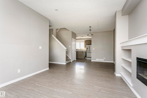 8103 Chappelle Way Sw, Edmonton, AB - Indoor Photo Showing Other Room With Fireplace