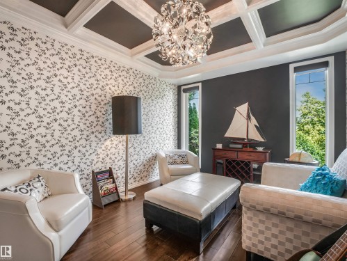 Coffered ceiling with a modern chandelier, dark wood-finish flooring, and tall windows - 967 Lamb Crescent Nw, Edmonton, AB - Indoor