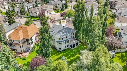 Expansive property featuring a large residence, a secondary building, and mature trees - 967 Lamb Crescent Nw, Edmonton, AB - Outdoor With View