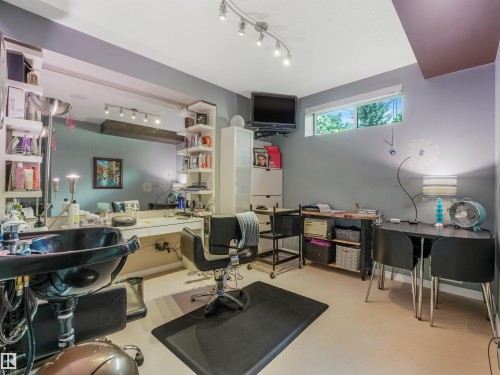 Recessed window, track lighting, built-in mirror, built-in shelving, hard surface flooring - 967 Lamb Crescent Nw, Edmonton, AB - Indoor Photo Showing Office