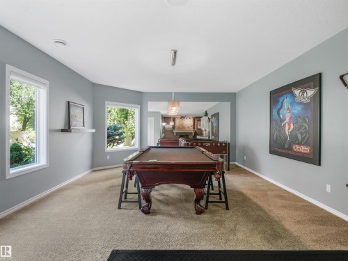 Expansive room featuring light gray walls, plush carpet flooring, and multiple windows - 967 Lamb Crescent Nw, Edmonton, AB - Indoor Photo Showing Other Room
