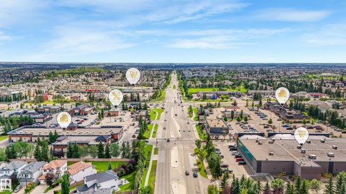 Established neighborhood with residential properties, commercial buildings, and a multi-lane road - 967 Lamb Crescent Nw, Edmonton, AB - Outdoor With View