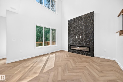 55 Meadowgrove Lane, Spruce Grove, AB - Indoor Photo Showing Other Room With Fireplace