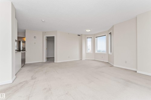 Open-concept living area with light-colored carpeting - #1101 10909 103 Av Nw, Edmonton, AB - Indoor Photo Showing Other Room