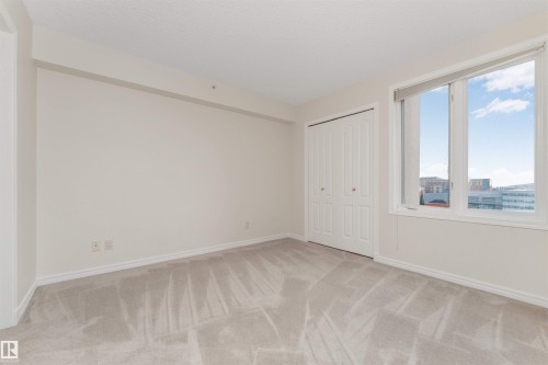 Neutral-toned walls with light gray carpet - #1101 10909 103 Av Nw, Edmonton, AB - Indoor Photo Showing Other Room