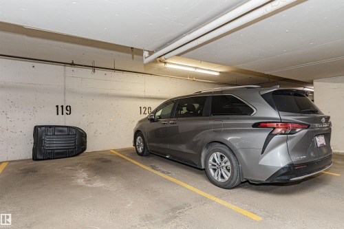 Underground parking stall with concrete walls and ceiling - #1101 10909 103 Av Nw, Edmonton, AB - Indoor Photo Showing Garage