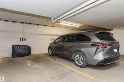 Designated parking space with concrete walls and ceiling - 