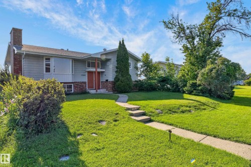 Split-level residence featuring a brick chimney and a prominent bay window - 13903 87 Street Nw, Edmonton, AB - Outdoor
