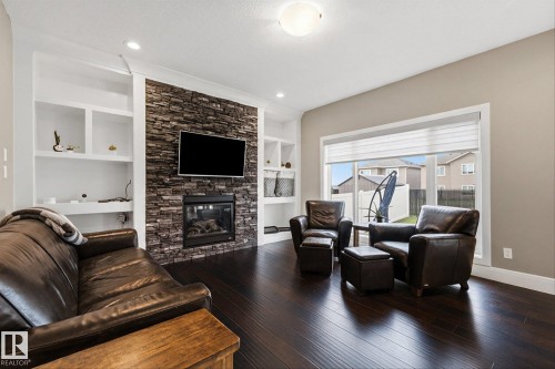 182 Woodhill Lane, Fort Saskatchewan, AB - Indoor Photo Showing Living Room With Fireplace